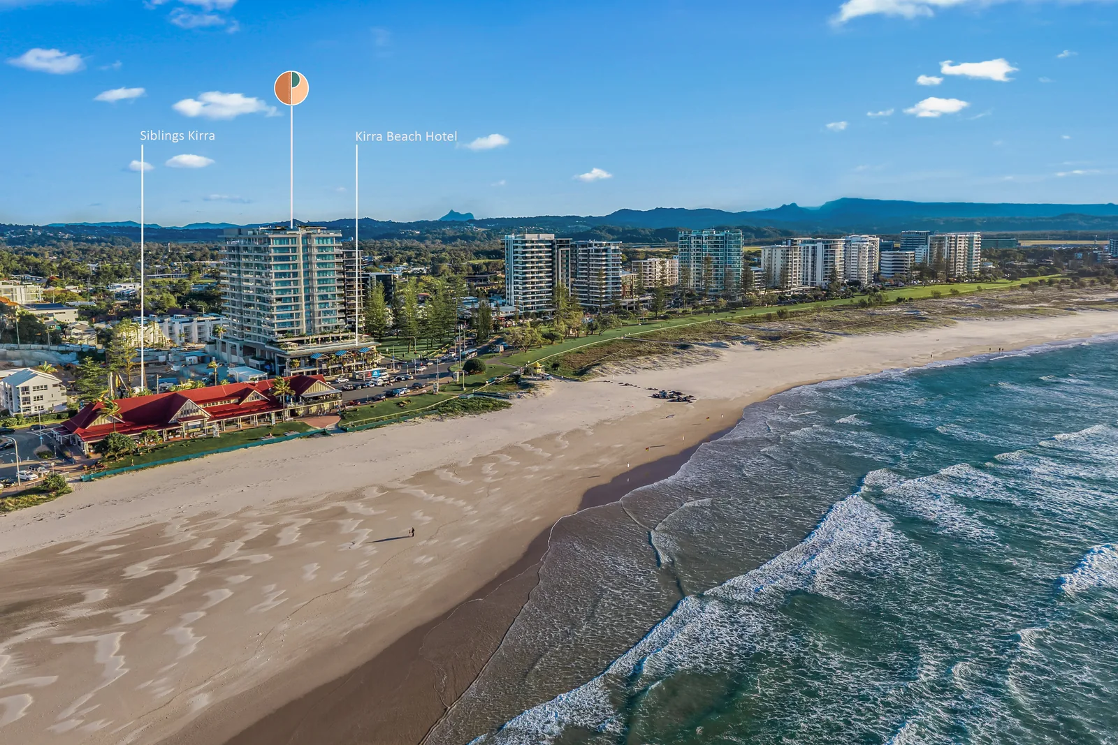 Wide aerial view along Kirra Beach, showing the beachfront location of The Kirra Suite